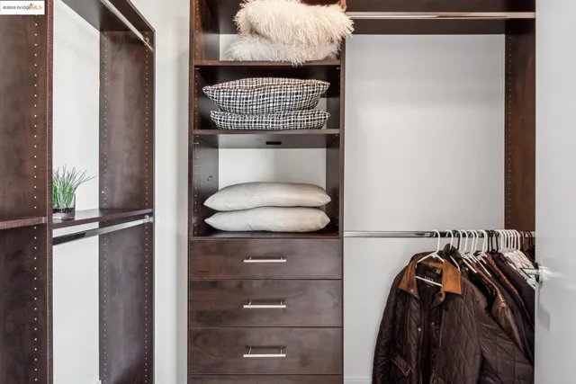 a view of a room with gym equipment and floor to ceiling window