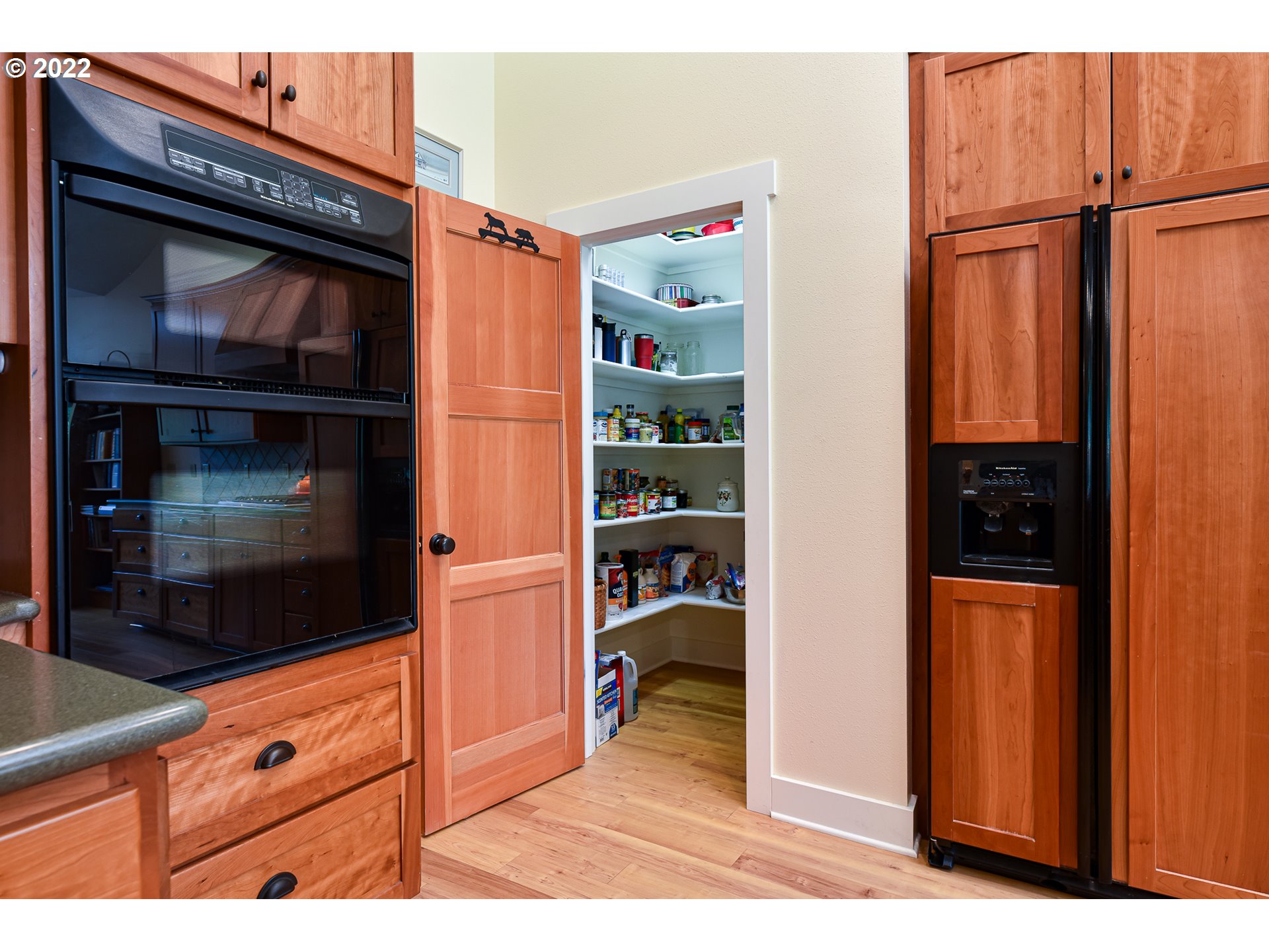 90730 Marcola Road Springfield, OR 97478 - Photo 10 of 30 a view of open kitchen with a refrigerator and cabinets
