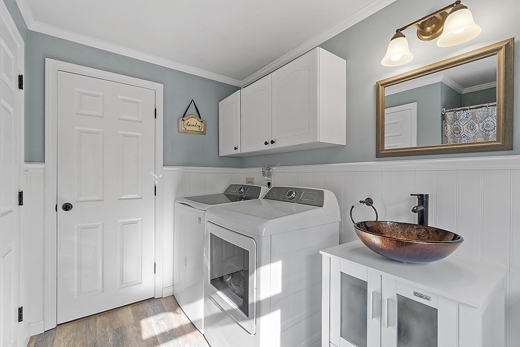 264 Hackett Hill Road Hooksett, NH 03106 - Photo 18 of 41 a kitchen with stainless steel appliances granite countertop a sink and a white cabinets