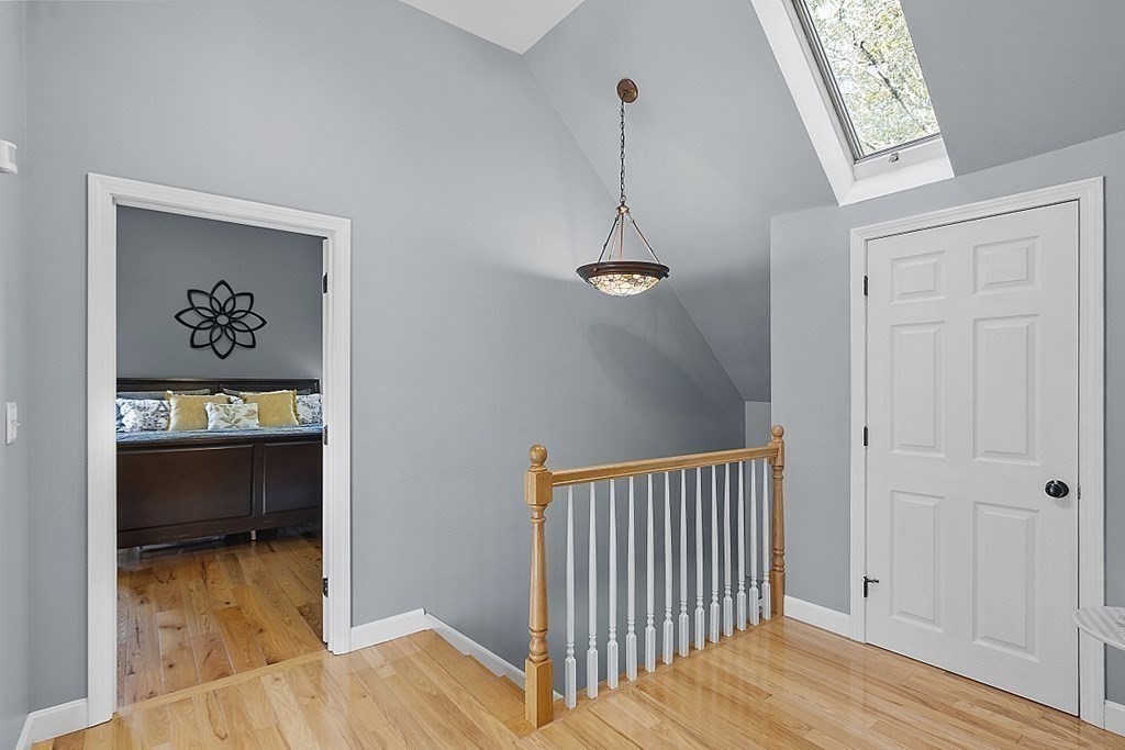 264 Hackett Hill Road Hooksett, NH 03106 - Photo 19 of 41 a view of a hallway view with wooden floor and staircase