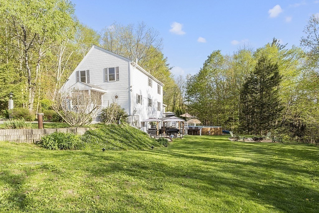 264 Hackett Hill Road Hooksett, NH 03106 - Photo 33 of 41 a view of a house with a yard