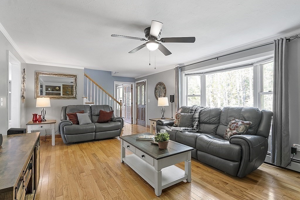 264 Hackett Hill Road Hooksett, NH 03106 - Photo 10 of 41 a living room with furniture and a large window