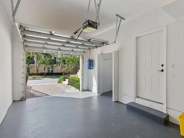 a view of a room with porch wooden floor and windows