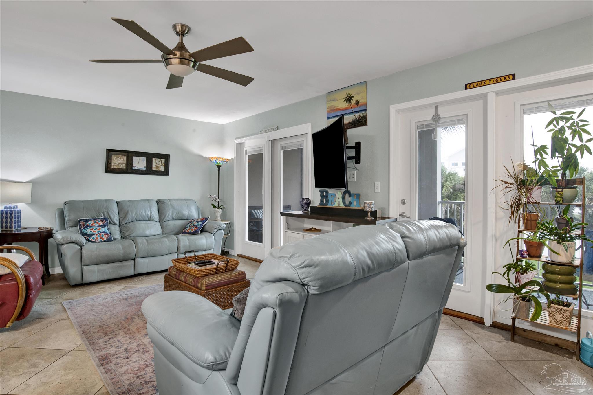 13351 Johnson Beach Road, Unit 203E Perdido Key, FL 32507 - Photo 8 of 55 a living room with furniture and a large window