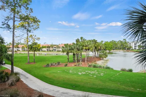 a view of a lake with a big yard