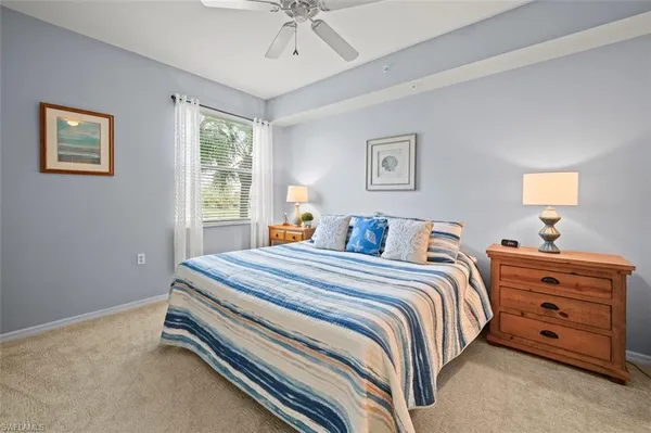 a bed room with a bed and a window