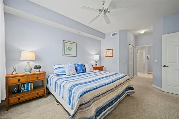 a bed room with a bed and a lamp