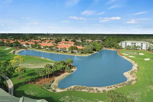 an aerial view of a residential houses with outdoor space