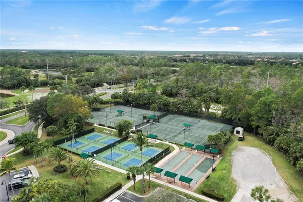 an aerial view of a house with yard swimming pool and outdoor seating
