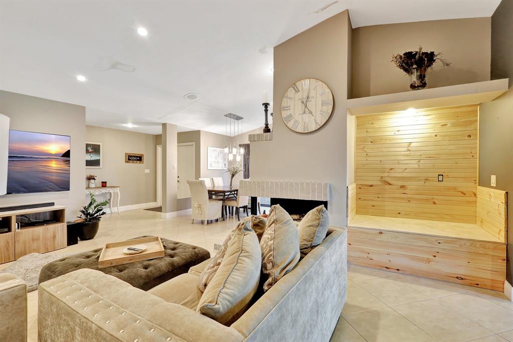 6810 Allegre Court Boca Raton, FL 33433 - Photo 16 of 29 a living room with furniture a large window and a flat screen tv
