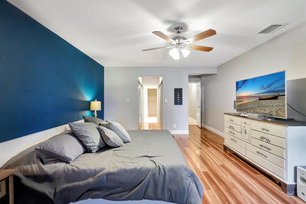 6810 Allegre Court Boca Raton, FL 33433 - Photo 24 of 29 a spacious bedroom with a bed and a flat screen tv