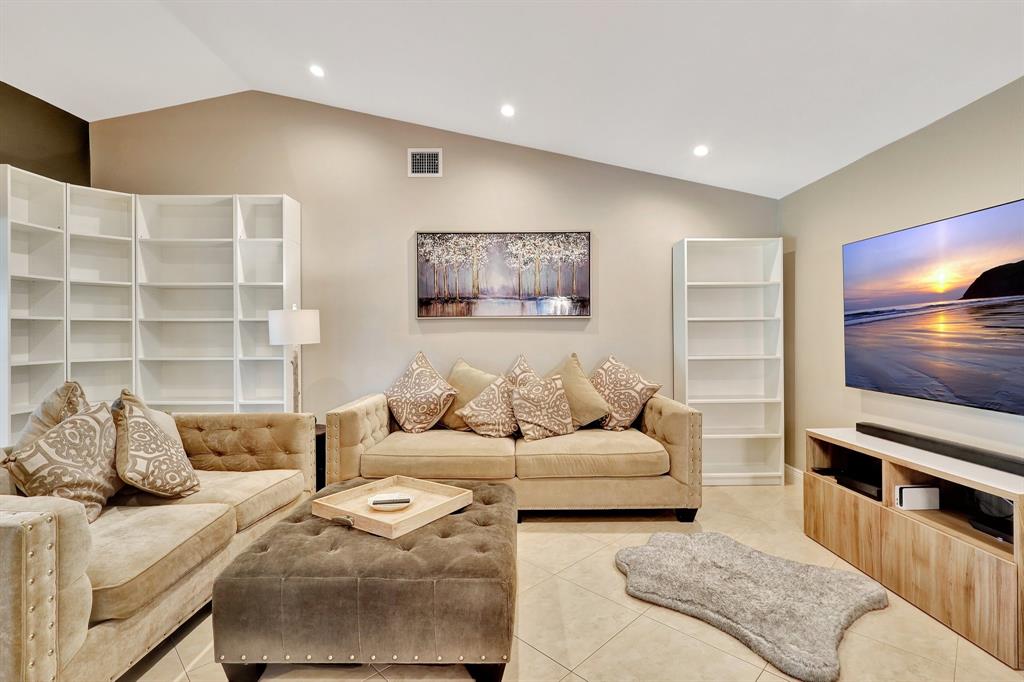 6810 Allegre Court Boca Raton, FL 33433 - Photo 6 of 29 a living room with furniture and a flat screen tv