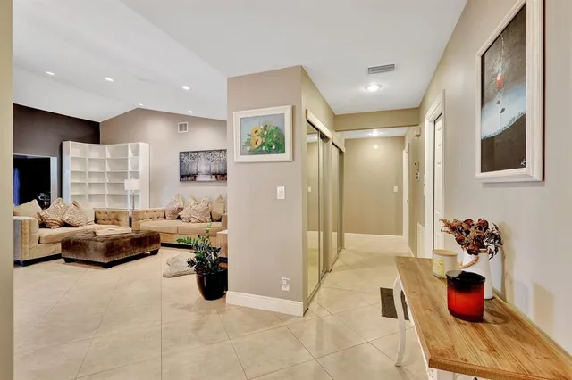 a living room with furniture chess table and a painting