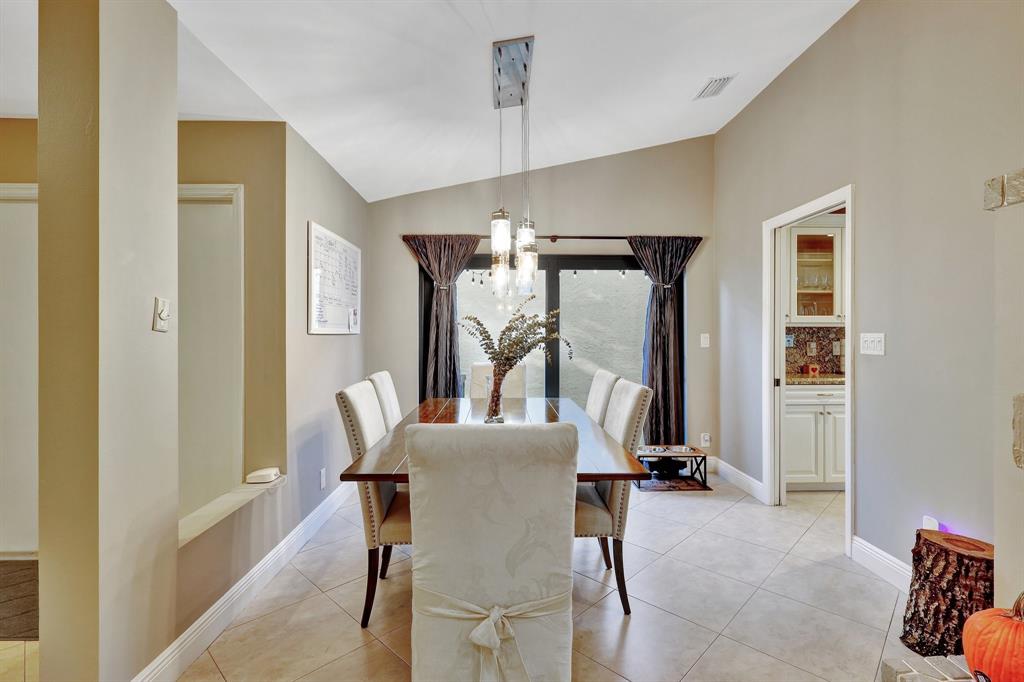 6810 Allegre Court Boca Raton, FL 33433 - Photo 9 of 29 a view of a dining room with furniture window and wooden floor