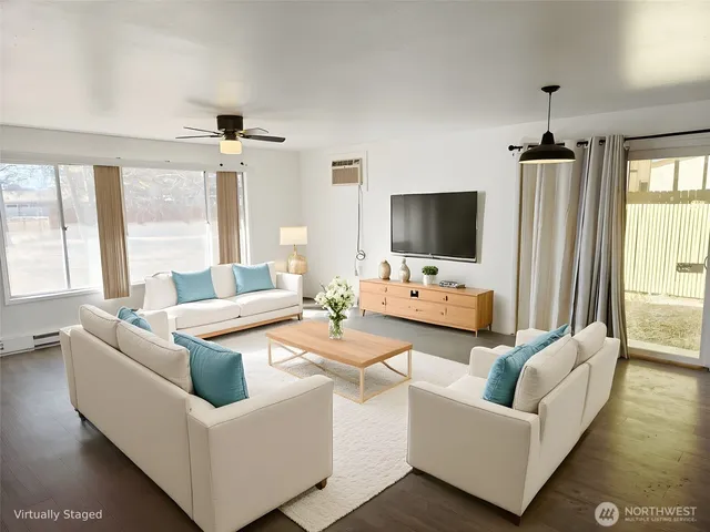 a living room with fireplace furniture and a flat screen tv