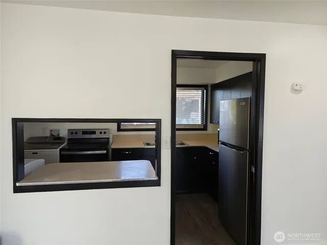 a kitchen with a stove and a microwave