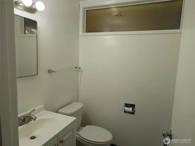 a bathroom with a sink and toilet
