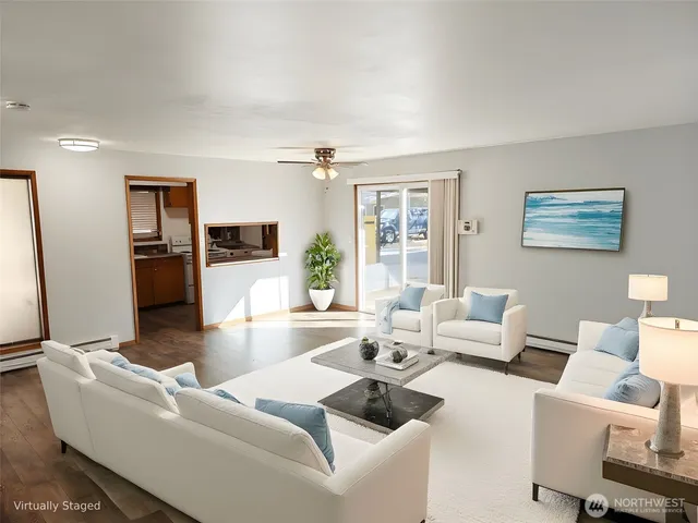 a kitchen with wooden floor and a stove