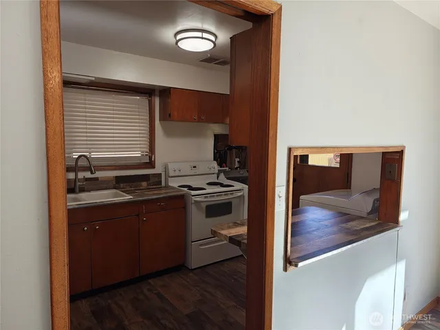 a kitchen with a stove and a microwave