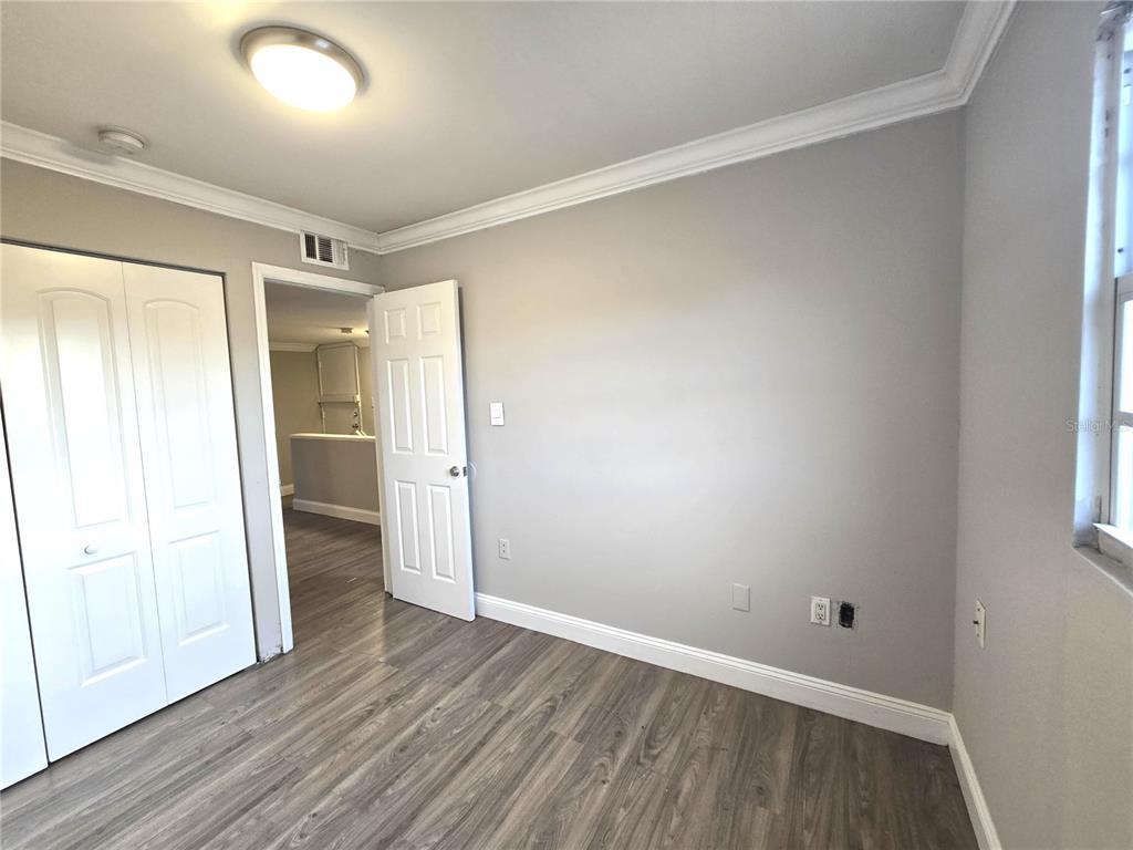 914 Southwest 8th Avenue, Unit 57 Gainesville, FL 32601 - Photo 21 of 31 wooden floor in an empty room