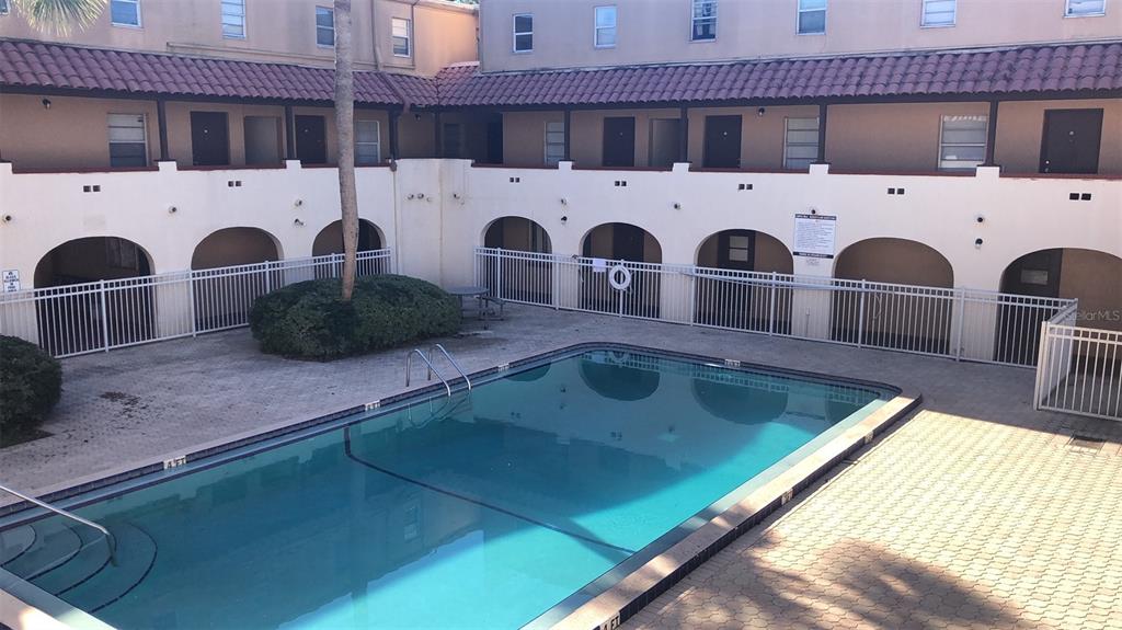 914 Southwest 8th Avenue, Unit 57 Gainesville, FL 32601 - Photo 30 of 31 a kitchen with stainless steel appliances granite countertop a sink and a stove top oven