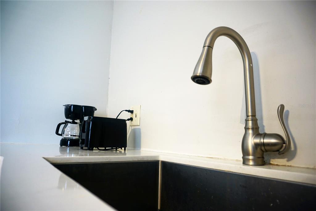 914 Southwest 8th Avenue, Unit 57 Gainesville, FL 32601 - Photo 10 of 31 a close view of table with chair