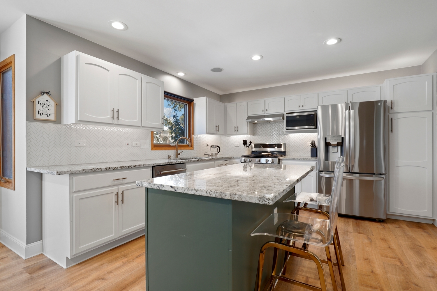 14710 Heathcliff Road Homer Glen, IL 60491 - Photo 5 of 27 a kitchen with kitchen island a refrigerator stove and sink
