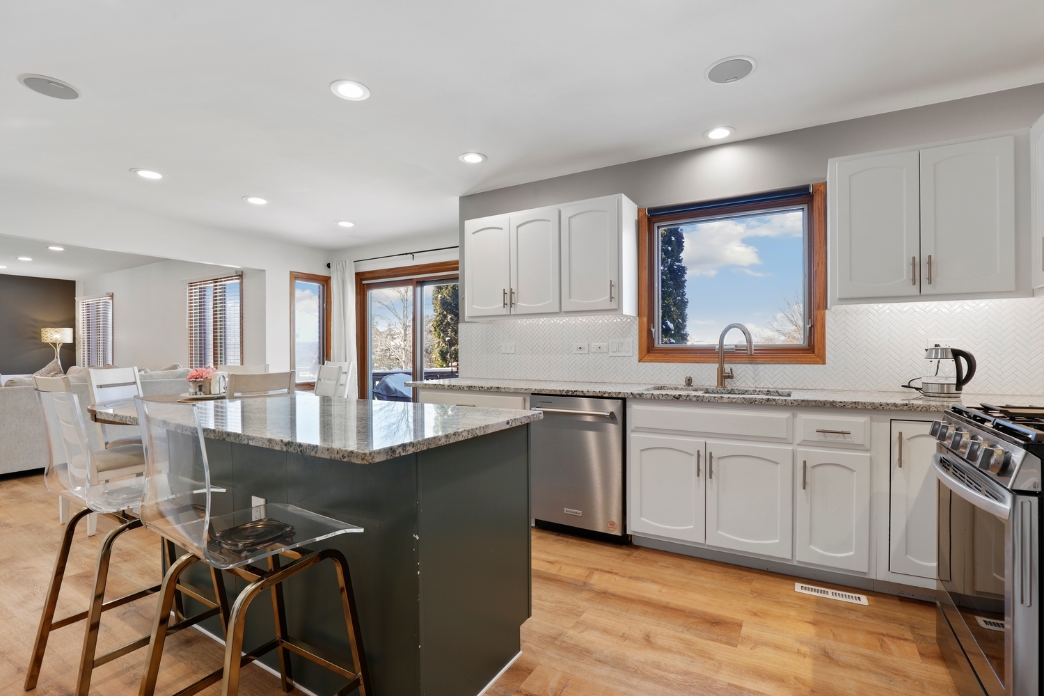 14710 Heathcliff Road Homer Glen, IL 60491 - Photo 6 of 27 a kitchen with granite countertop a sink and cabinets