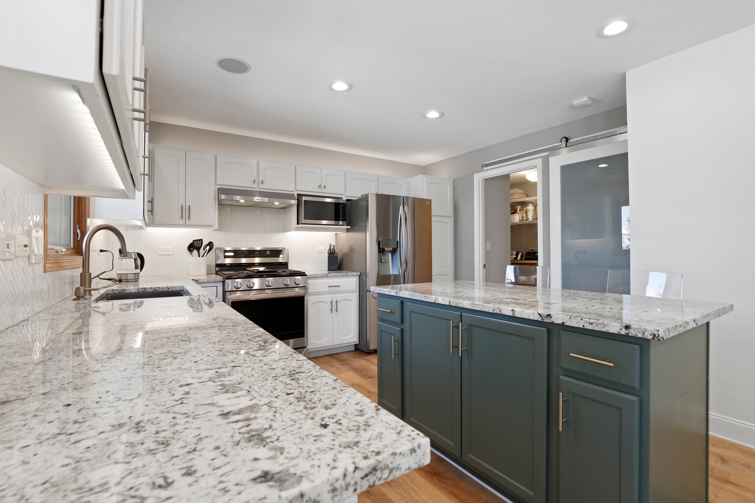 14710 Heathcliff Road Homer Glen, IL 60491 - Photo 7 of 27 a kitchen with granite countertop a sink stove and refrigerator