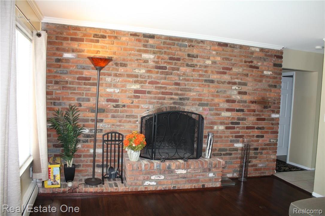 761 West Maple Road, Unit 54 Clawson, MI 48017 - Photo 4 of 17 Fireplace.jpg