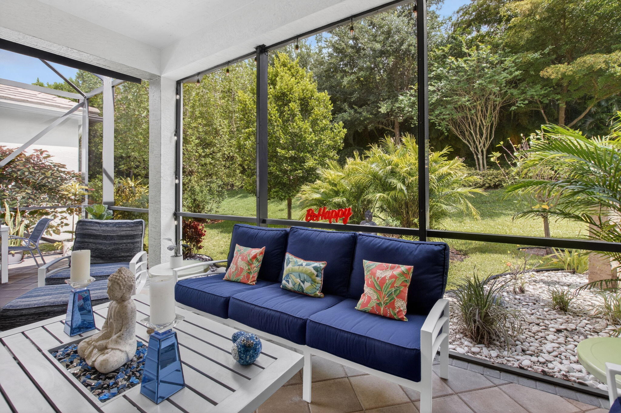 8263 Arabian Range Road Boynton Beach, FL 33473 - Photo 5 of 52 a outdoor living room with furniture and a floor to ceiling window