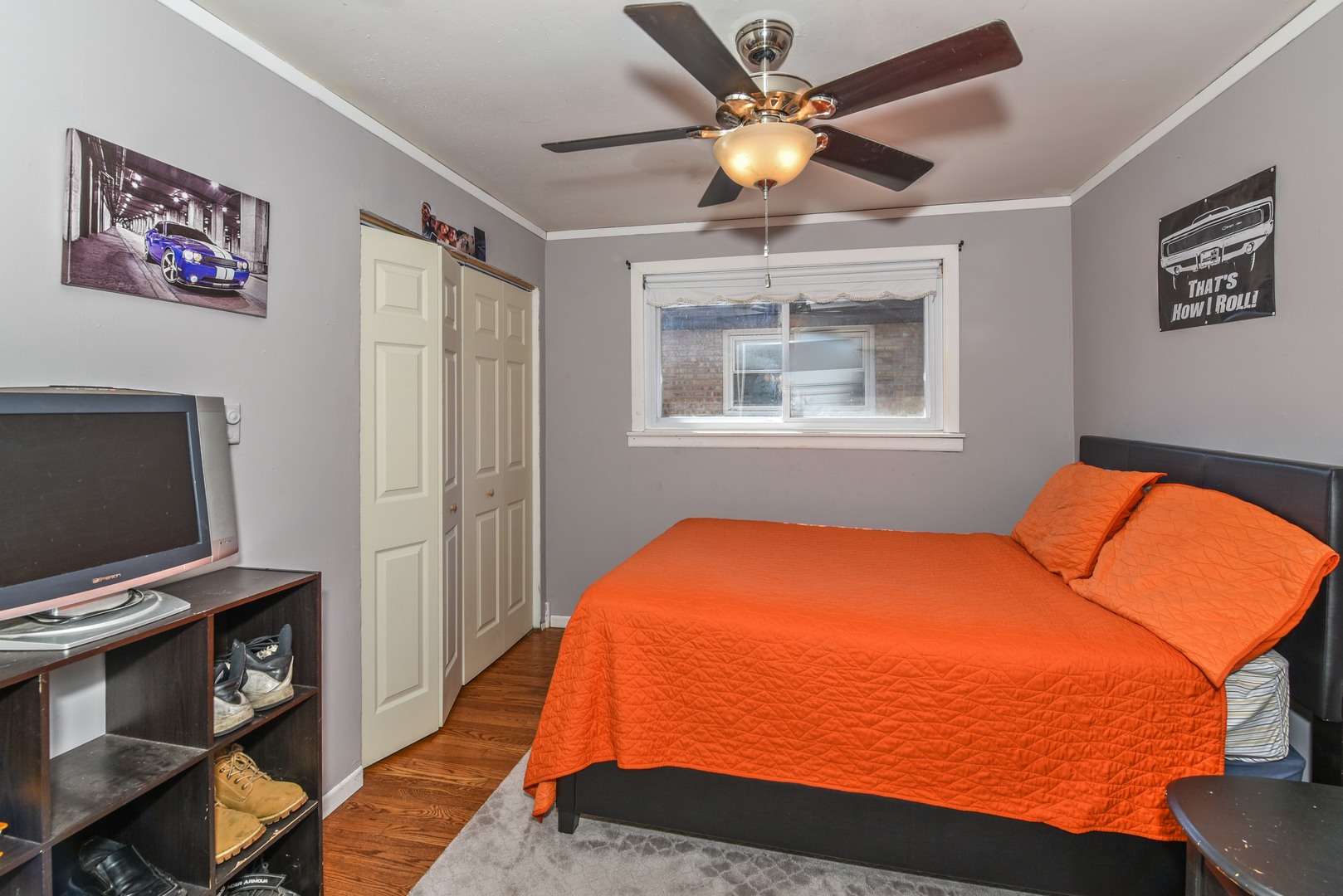 10920 Rutherford Avenue Worth, IL 60482 - Photo 12 of 15 a bedroom with a bed and a flat screen tv