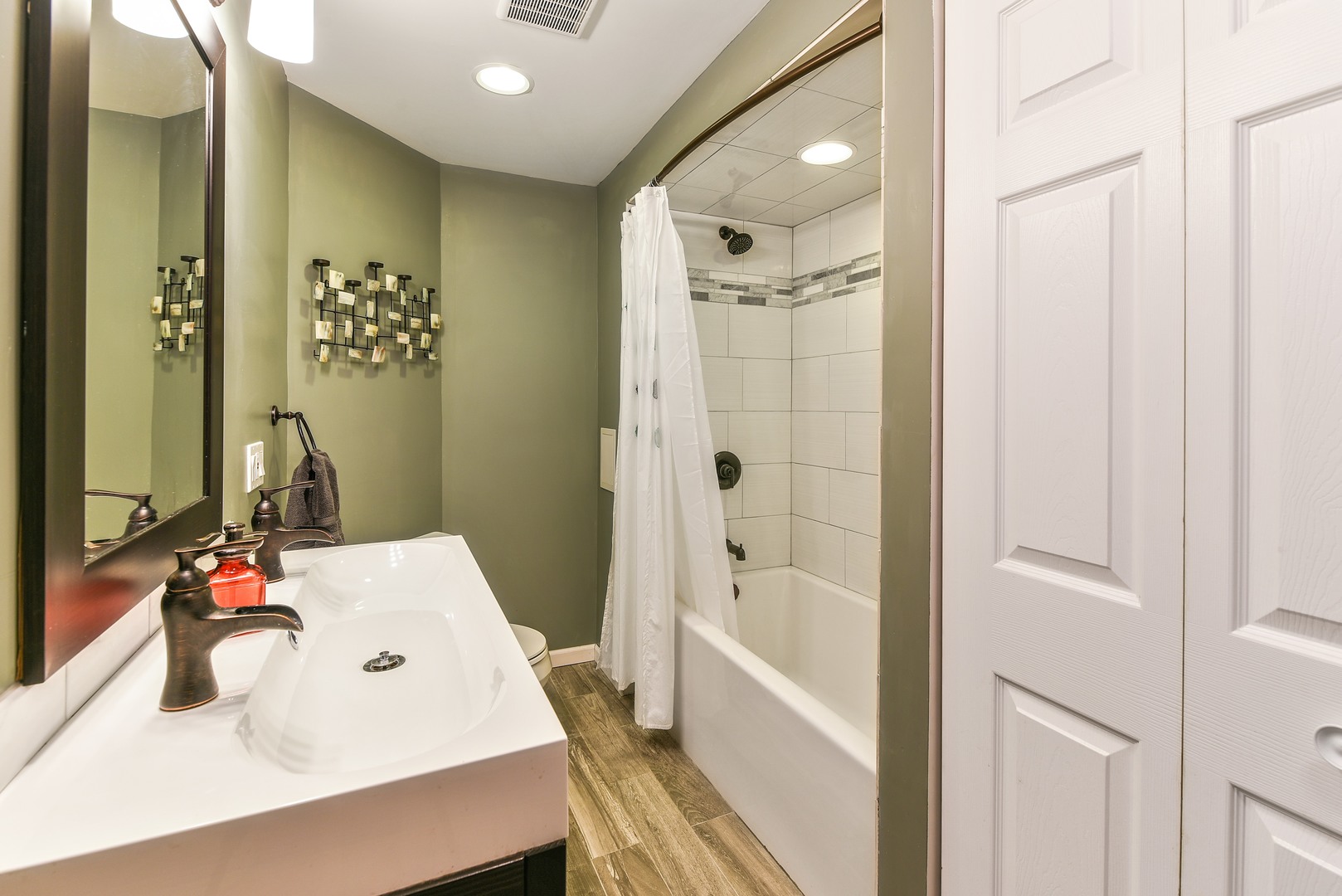 10920 Rutherford Avenue Worth, IL 60482 - Photo 9 of 15 a bathroom with a sink and a mirror