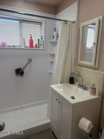 a bathroom with a sink and a mirror