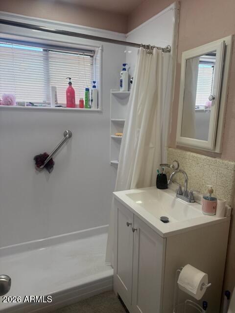 2922 West Fillmore Street Phoenix, AZ 85009 - Photo 4 of 13 a bathroom with a sink and a mirror