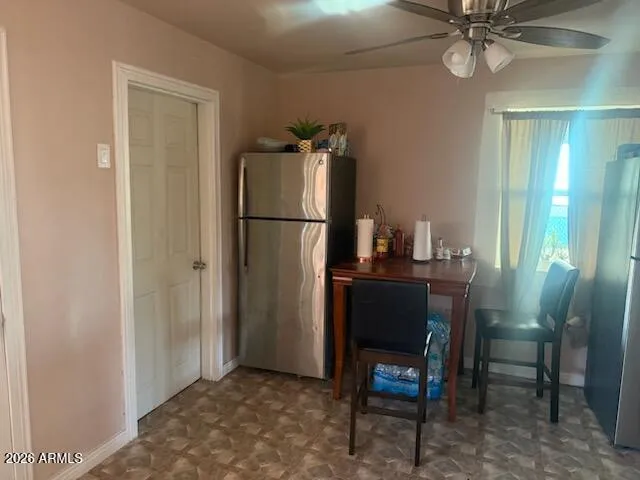 a room with a table and chairs