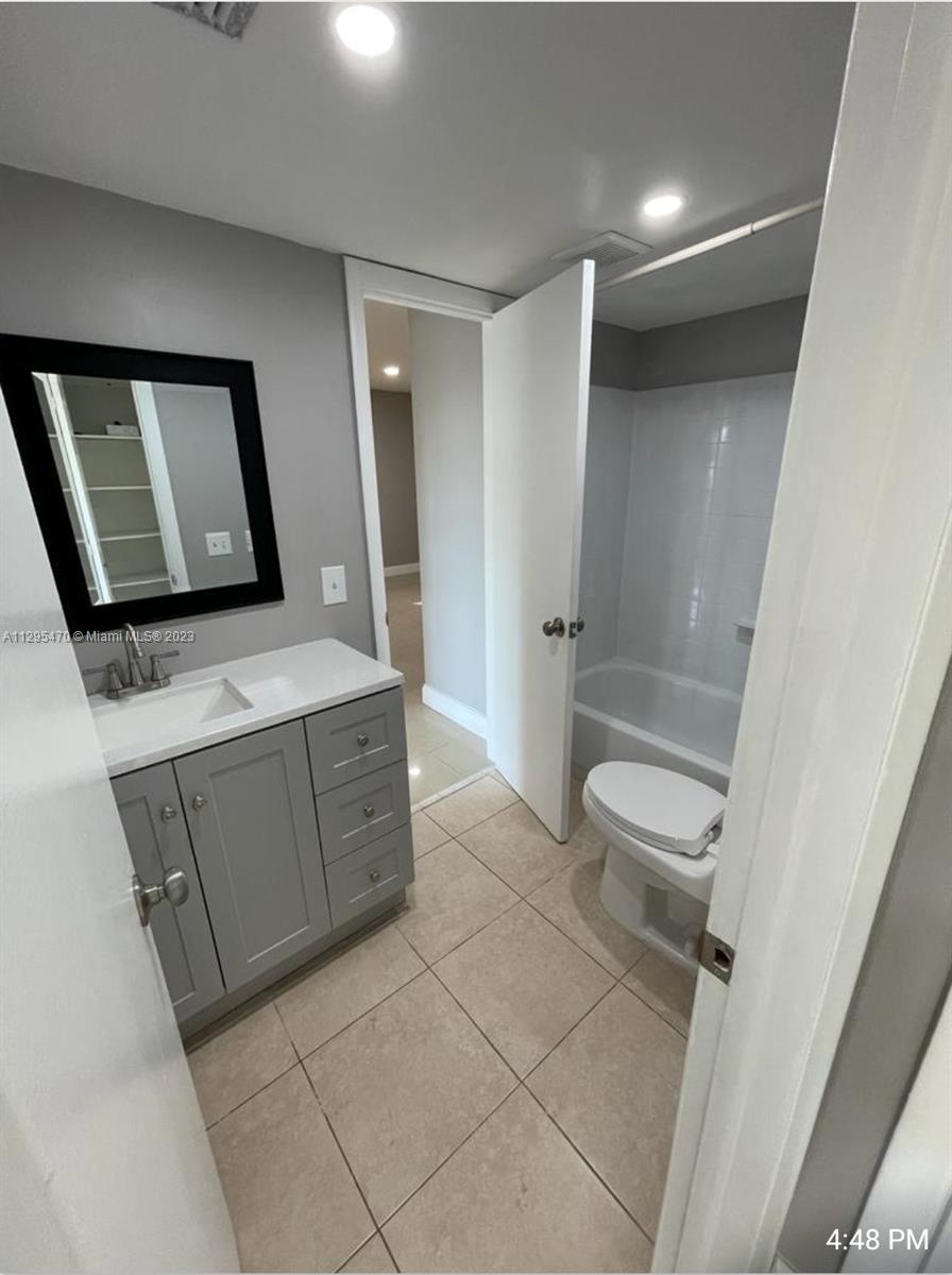 Davie Davie, FL 33024 - Photo 7 of 11 a bathroom with a sink a toilet and shower