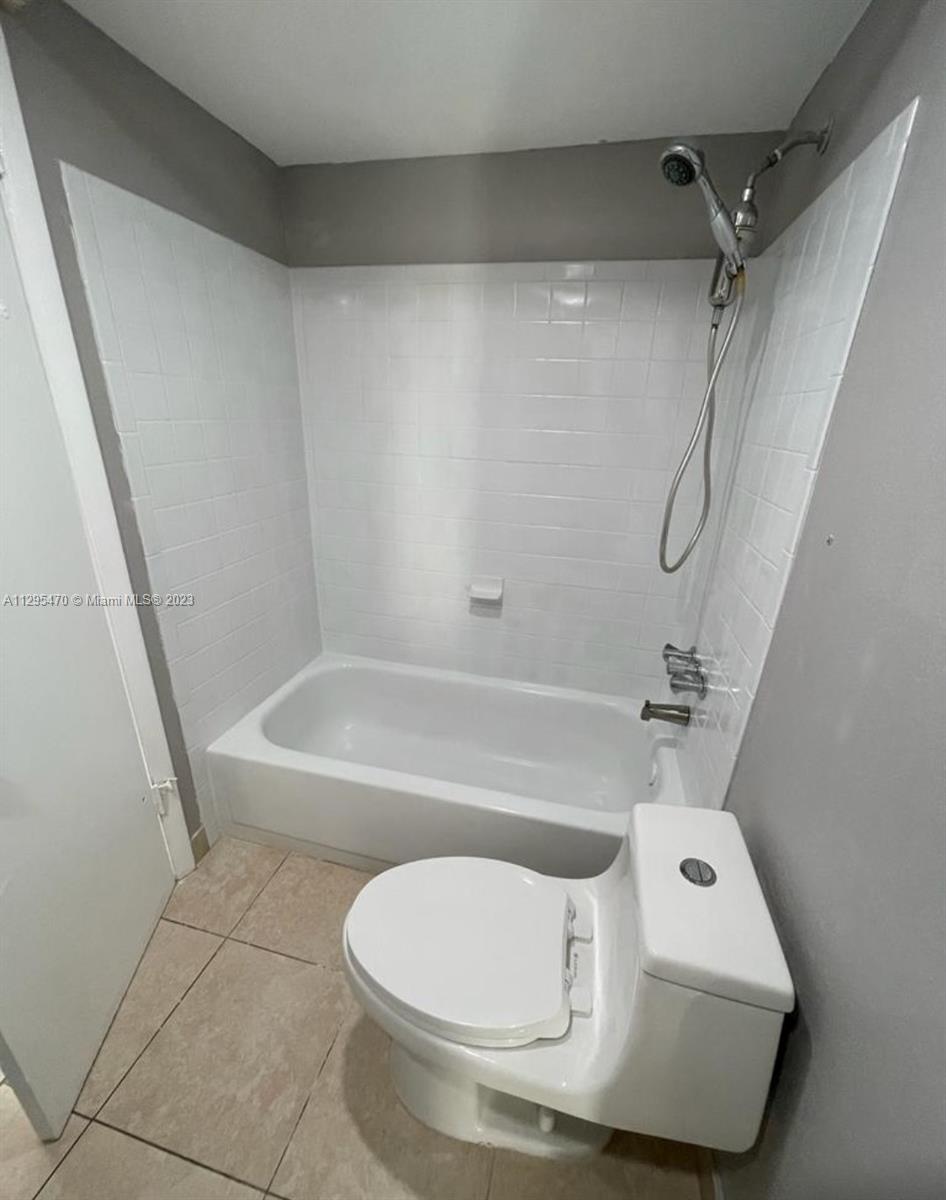 Davie Davie, FL 33024 - Photo 9 of 11 a bathroom with a toilet and a bathtub