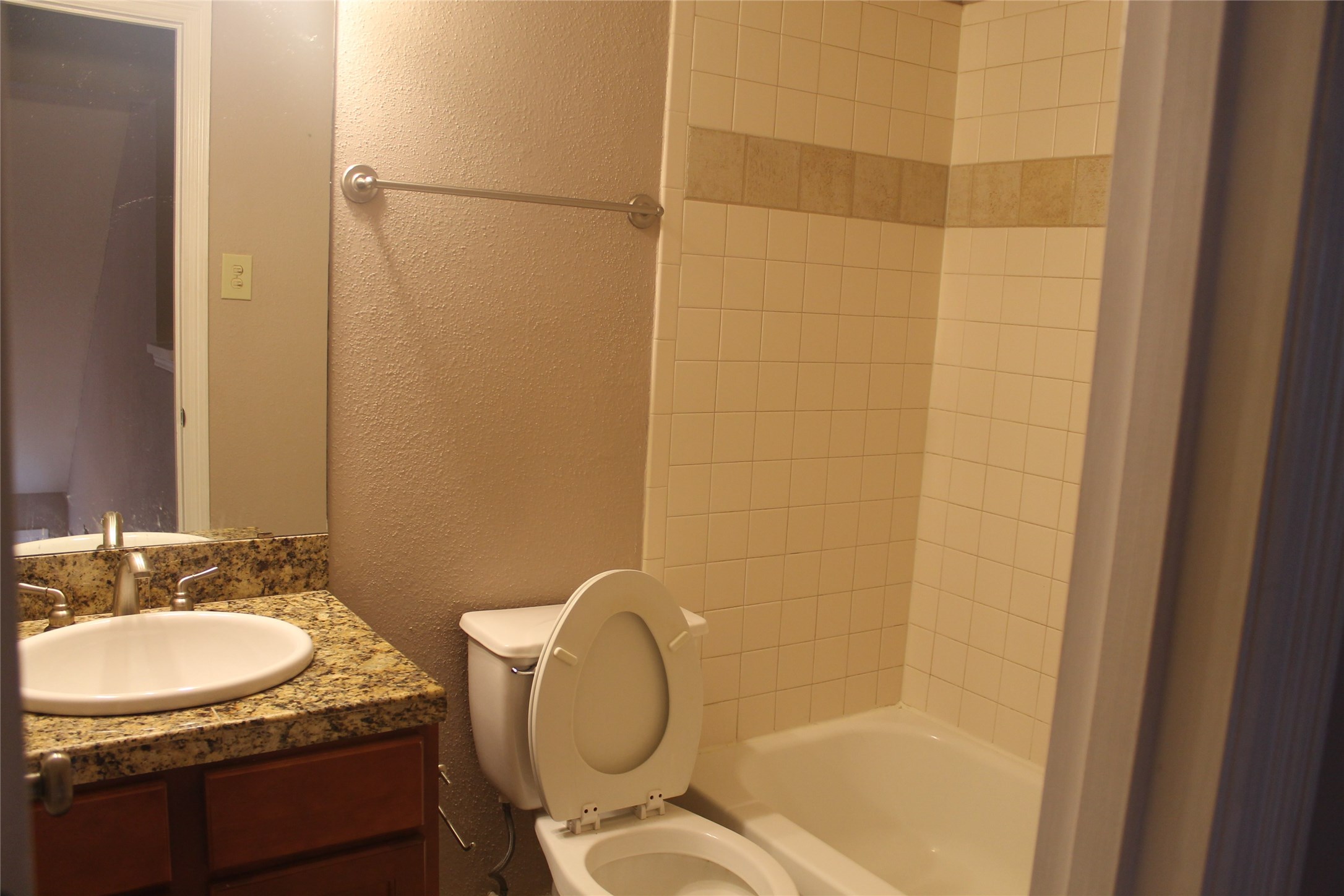 2211 South Kirkwood Road, Unit 59 Houston, TX 77077 - Photo 11 of 16 a bathroom with a granite countertop sink toilet and shower