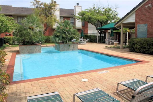 2211 South Kirkwood Road, Unit 59 Houston, TX 77077 - Photo 15 of 16 a view of a house with pool and chairs