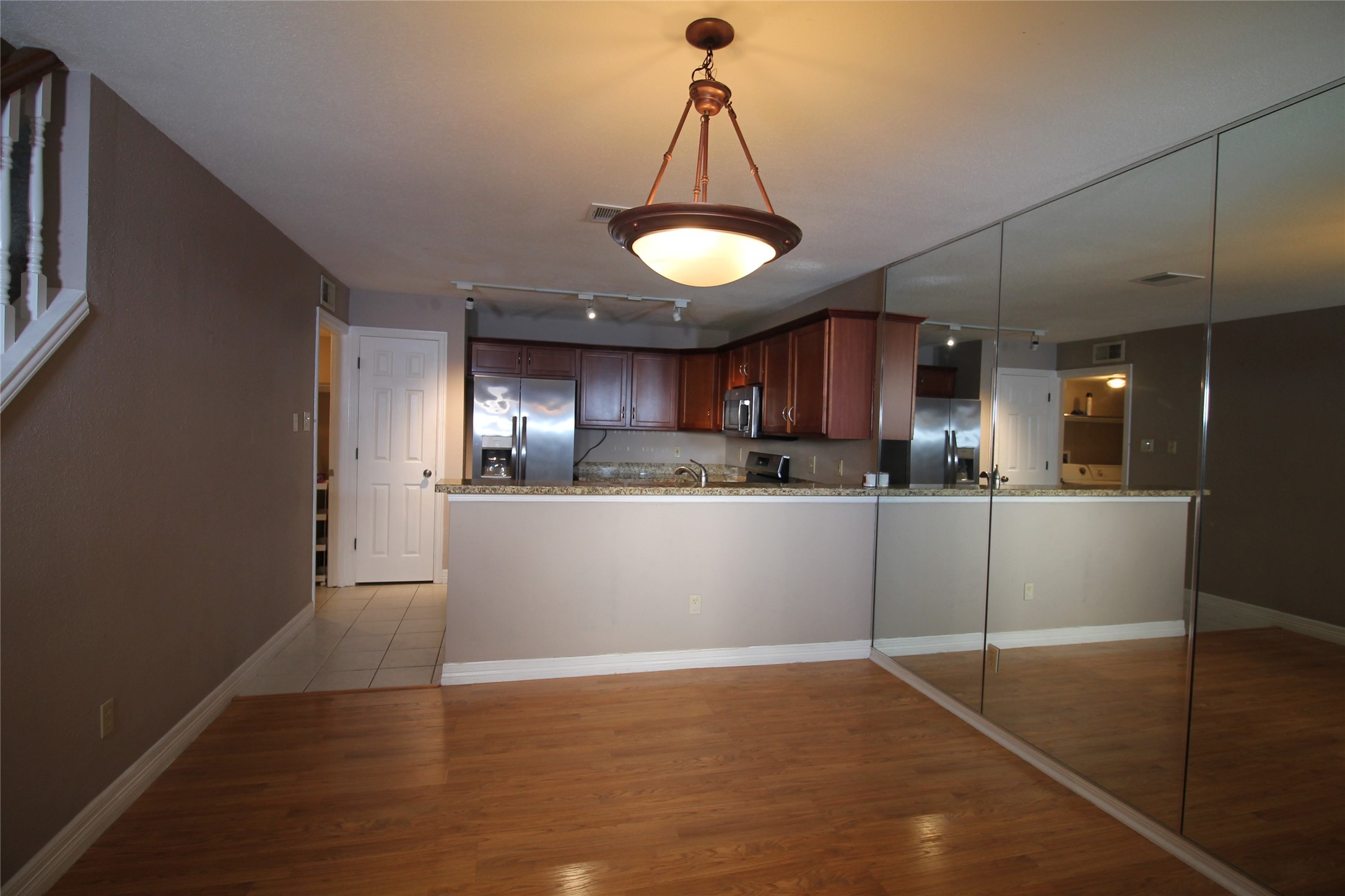 2211 South Kirkwood Road, Unit 59 Houston, TX 77077 - Photo 5 of 16 a view of a kitchen with a sink and refrigerator