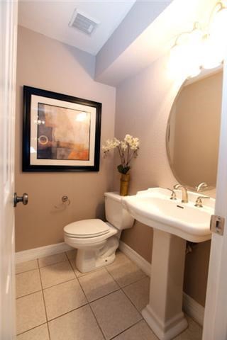 2211 South Kirkwood Road, Unit 59 Houston, TX 77077 - Photo 7 of 16 a bathroom with a toilet sink and mirror