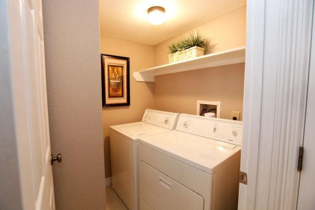 2211 South Kirkwood Road, Unit 59 Houston, TX 77077 - Photo 8 of 16 a utility room with dryer and washer