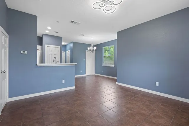 a view of a kitchen with a dishwasher and a window