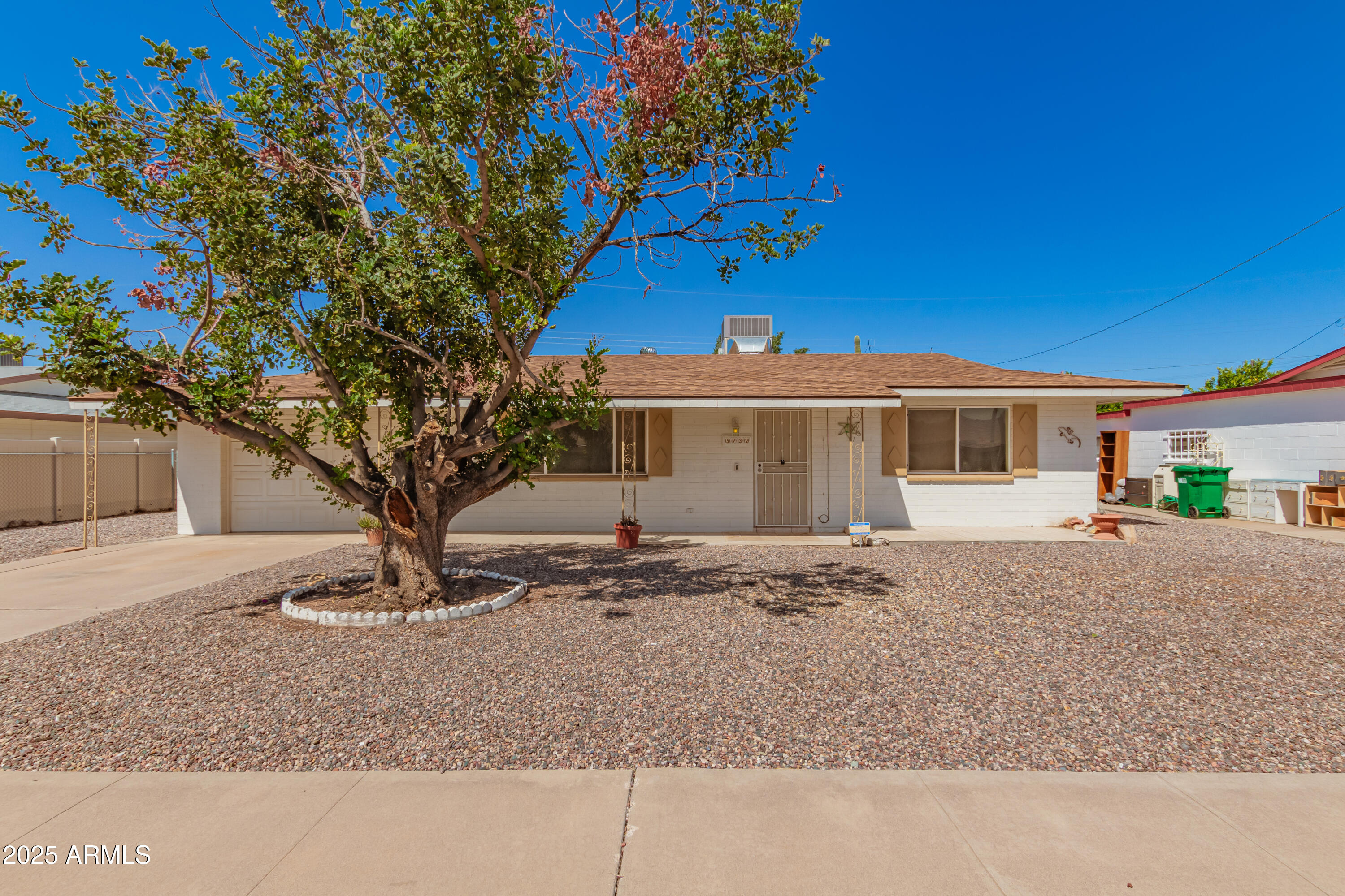 5732 Covina Road Mesa, AZ 85205 - Photo 1 of 24 a front view of a house with a yard