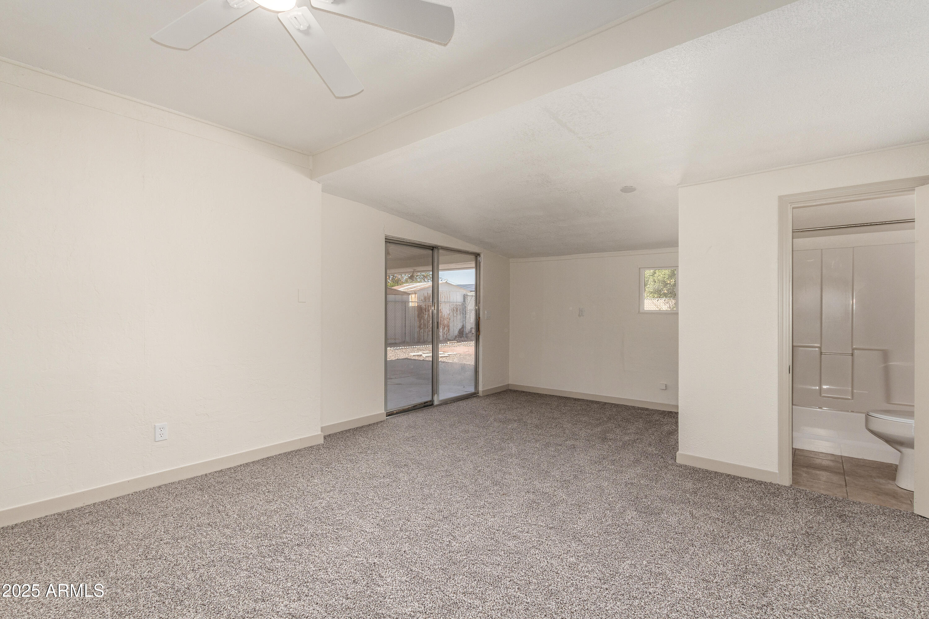 5732 Covina Road Mesa, AZ 85205 - Photo 11 of 24 an empty room with a bathroom