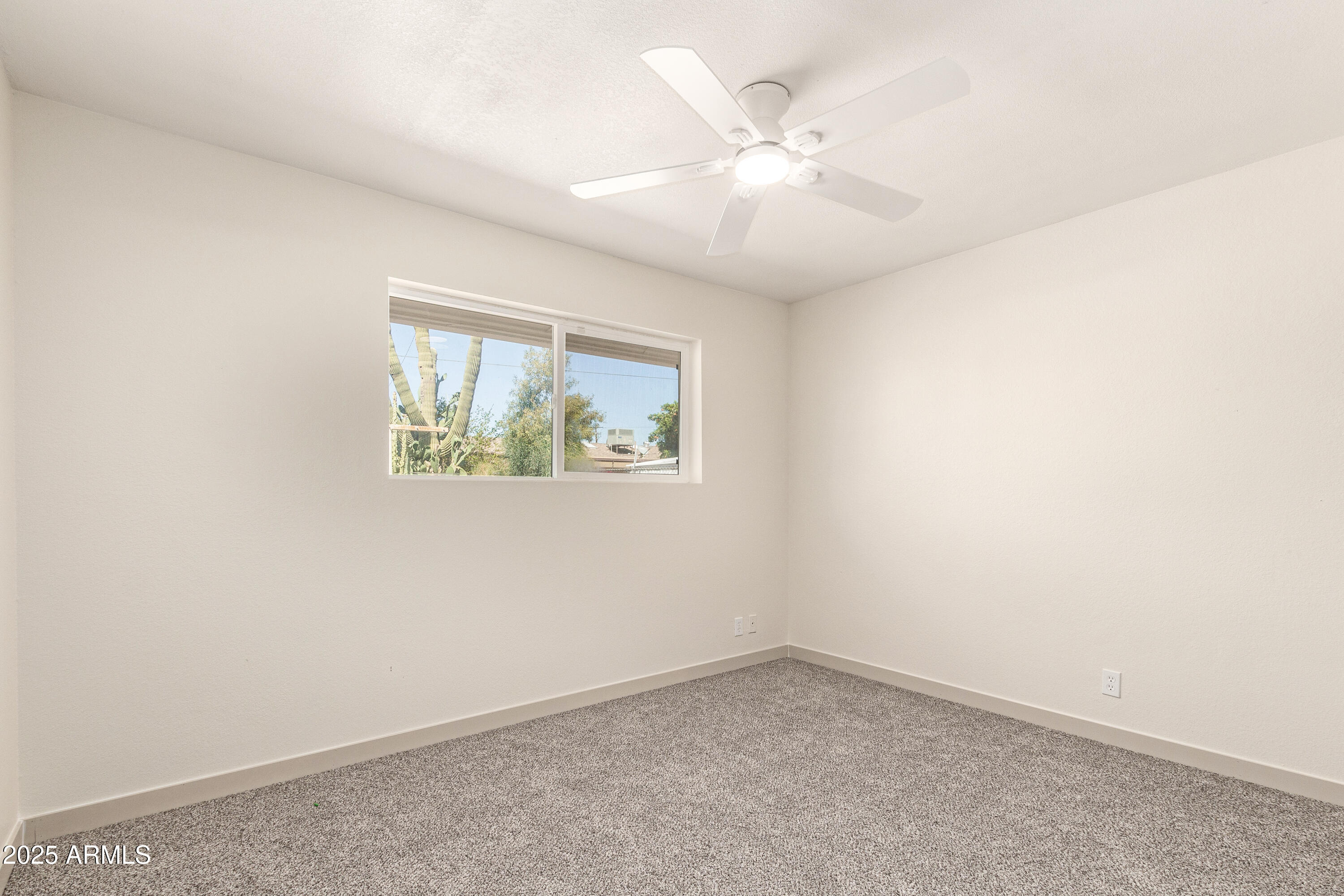 5732 Covina Road Mesa, AZ 85205 - Photo 14 of 24 an empty room with a window