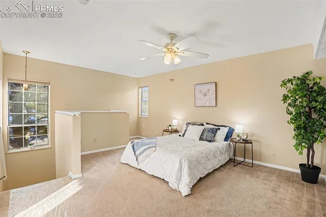 a bed room with a bed and a chandelier
