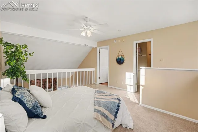 a bathroom with a granite countertop sink a mirror and a bathtub