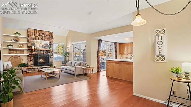a view of an entryway with wooden floor